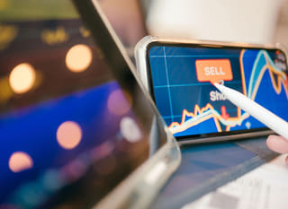 Trader analyzing forex options alongside Bitcoin and Ethereum across multiple markets